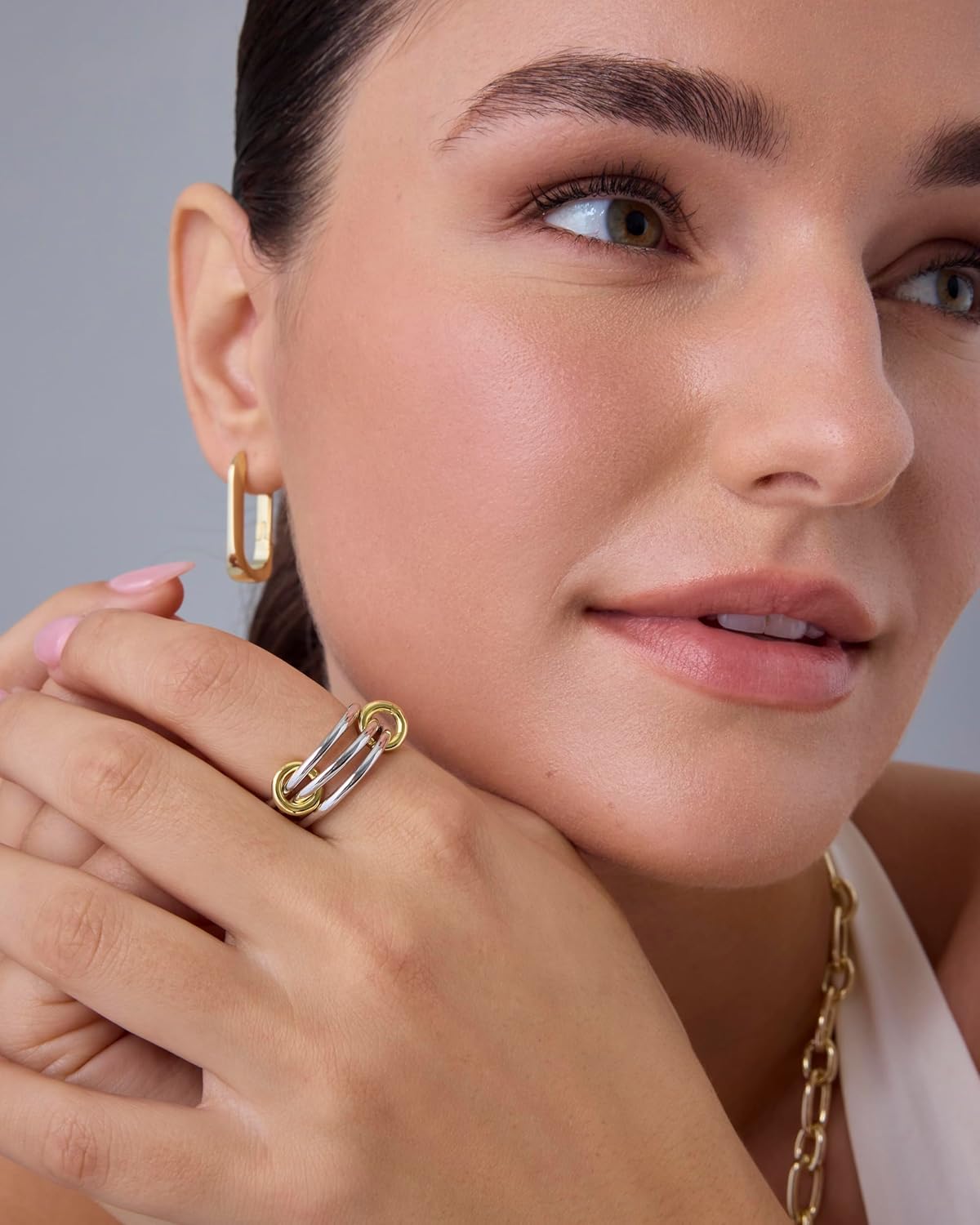 A model showcasing an elegant piece of handcrafted jewelry, representing the style and spirit of GCD Jewelry.