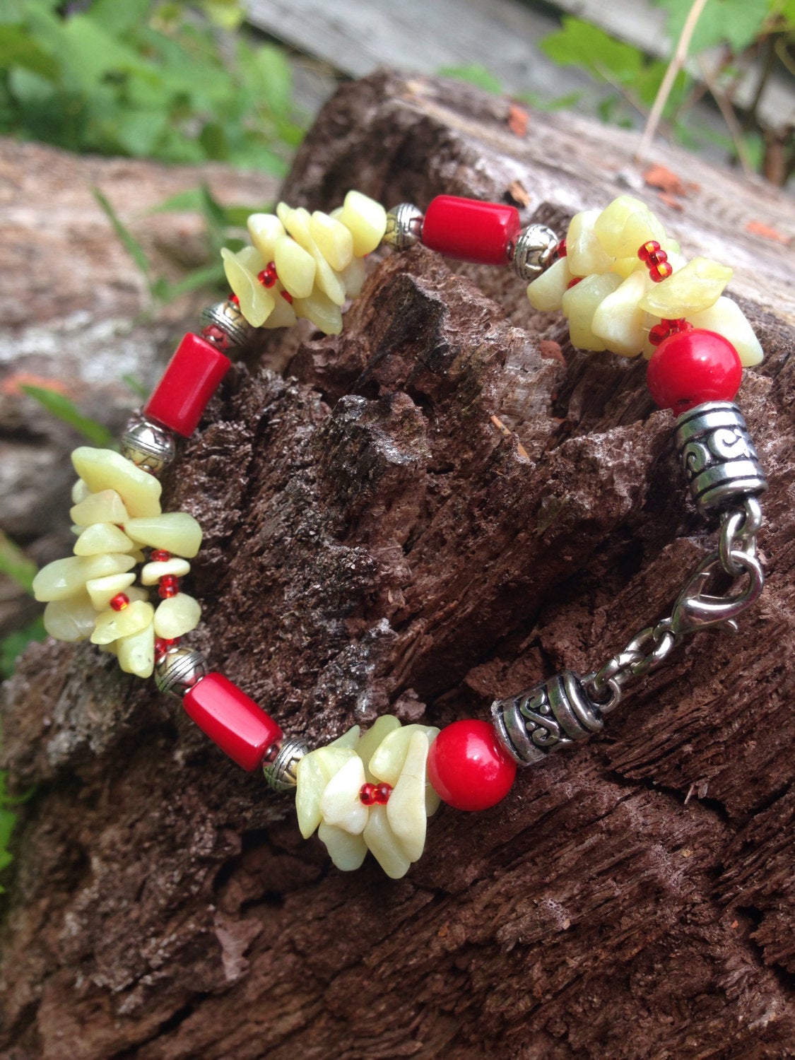 JADE and CORAL ladies bracelet with Red Coral and Bowenite New Jade stone beads on tree bark background