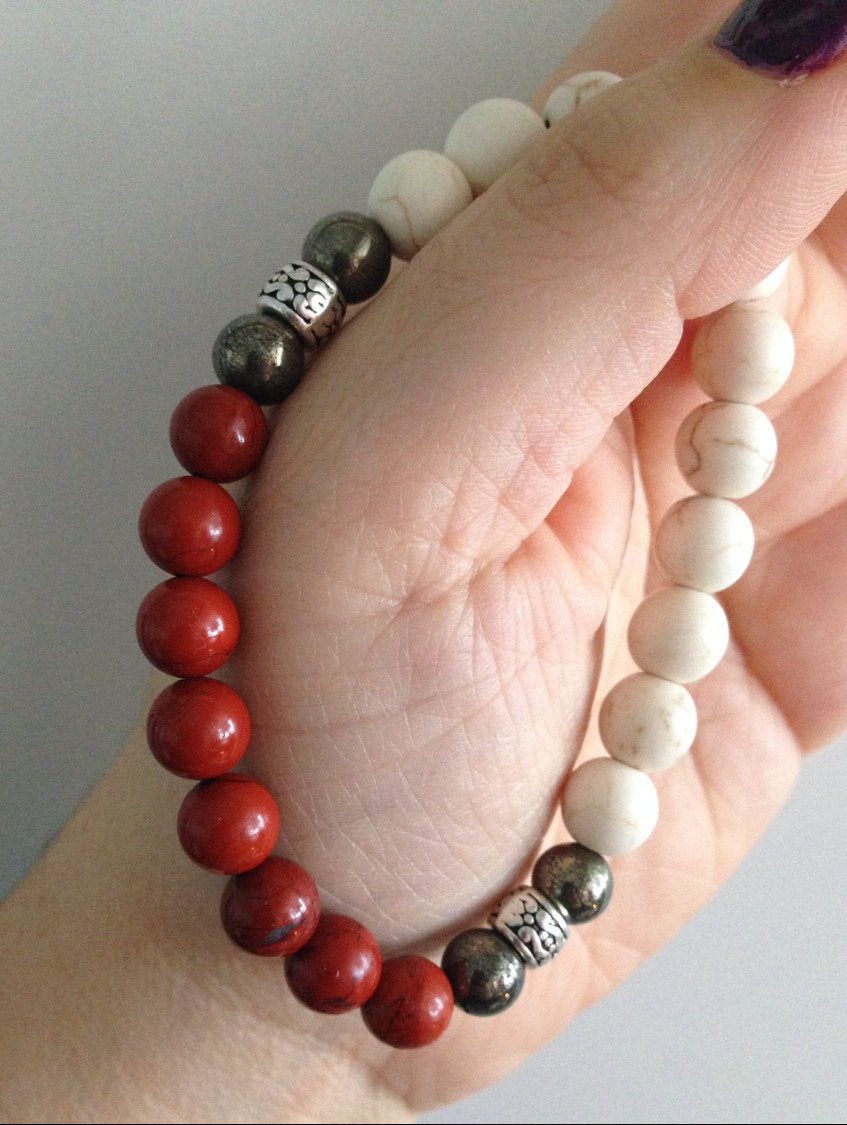 Mens bracelet with howlite, pyrite, and red jasper stones featuring yin yang balance design.