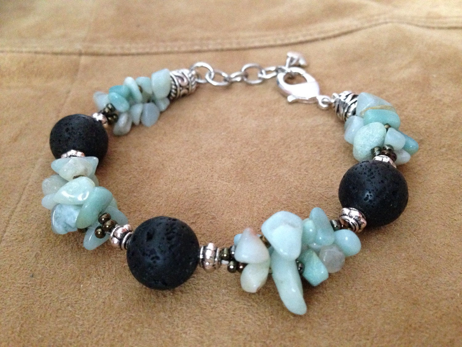 Women's bracelet with amazonite stones and black lava beads on adjustable chain clasp