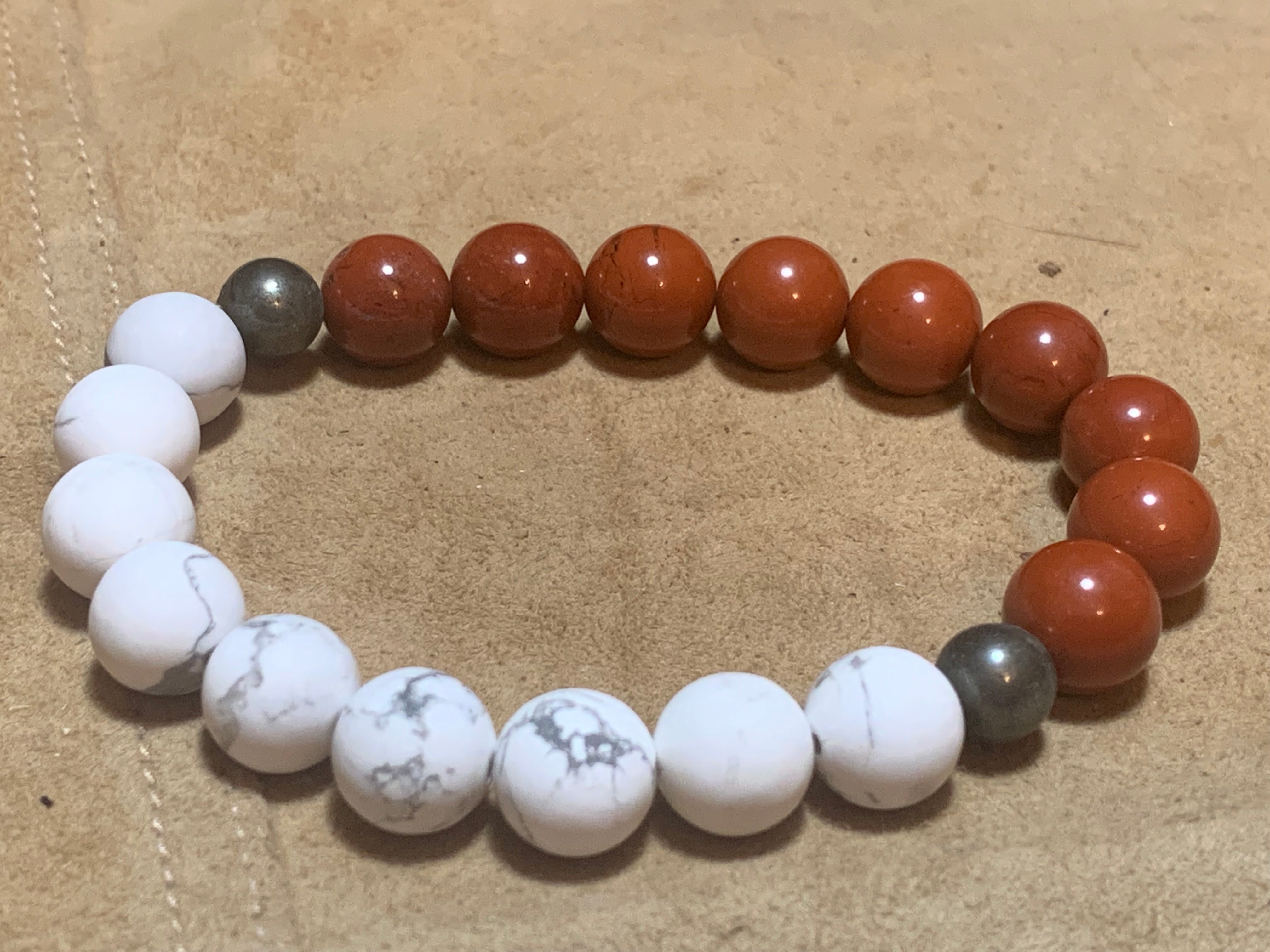 Passion calming bracelet with red jasper, pyrite, and howlite stones.